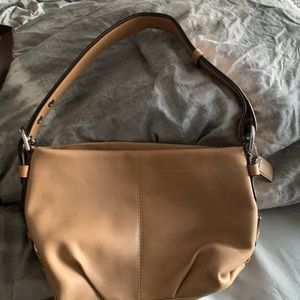 Brand new Coach purse never used.It’s light tan and in mint condition!
